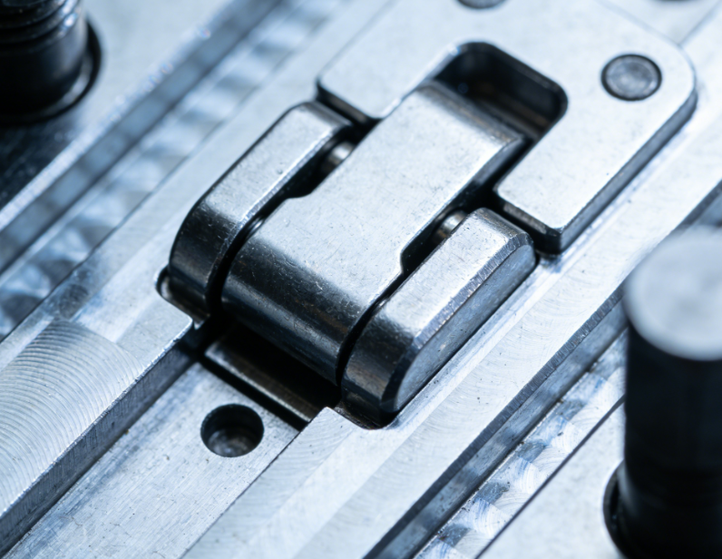 Close-up of WEDM-finished surface on a precision forming die insert made of M2 steel.